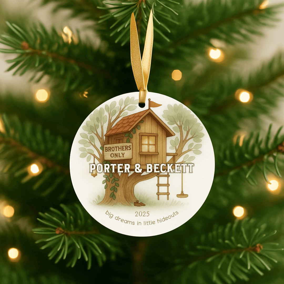 Personalized ceramic Christmas ornament with a treehouse, for brothers or young boys, hanging on a Christmas tree