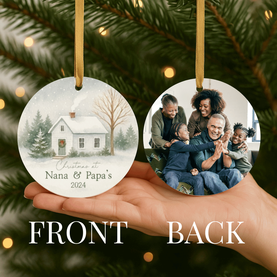 Round personalized Christmas ornament showing a snowy house on one side and a photo on the back
