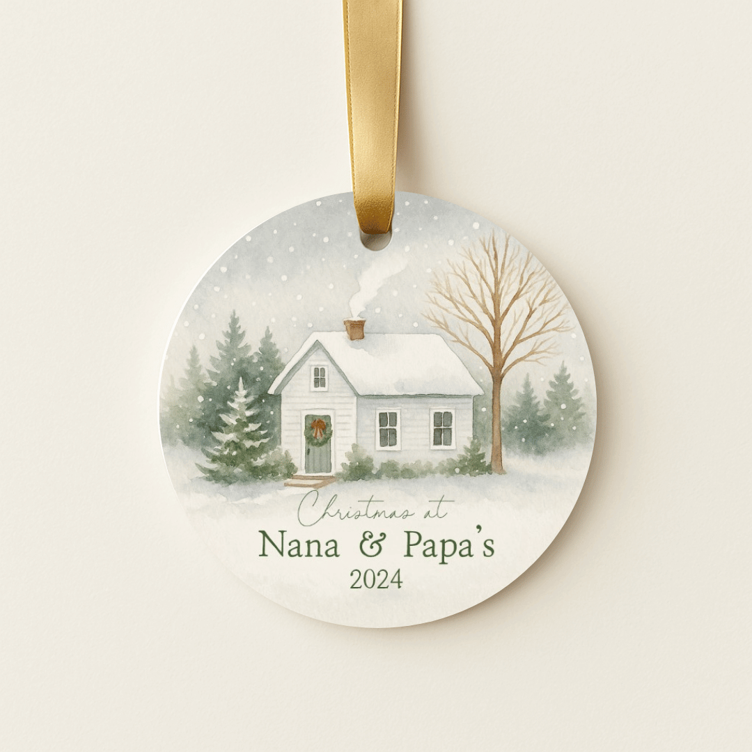 Round Christmas ornament with a snowy scene and &