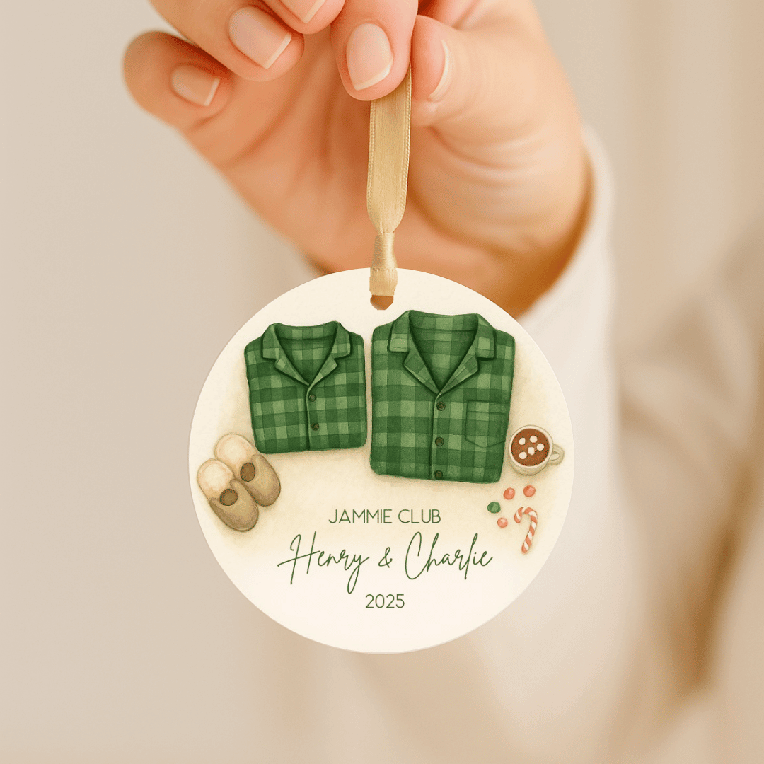 Round personalized ceramic Christmas ornament with matching green plaid family pajamas