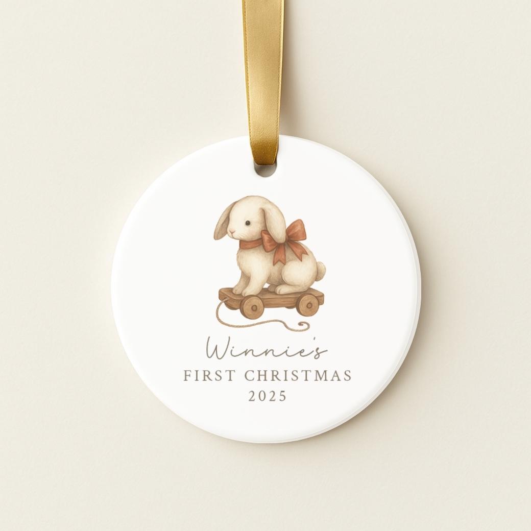 Round ceramic ornament with a bunny pull toy for a baby&