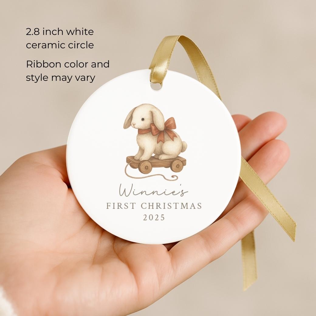 Round ceramic ornament with a bunny pull toy for a baby&