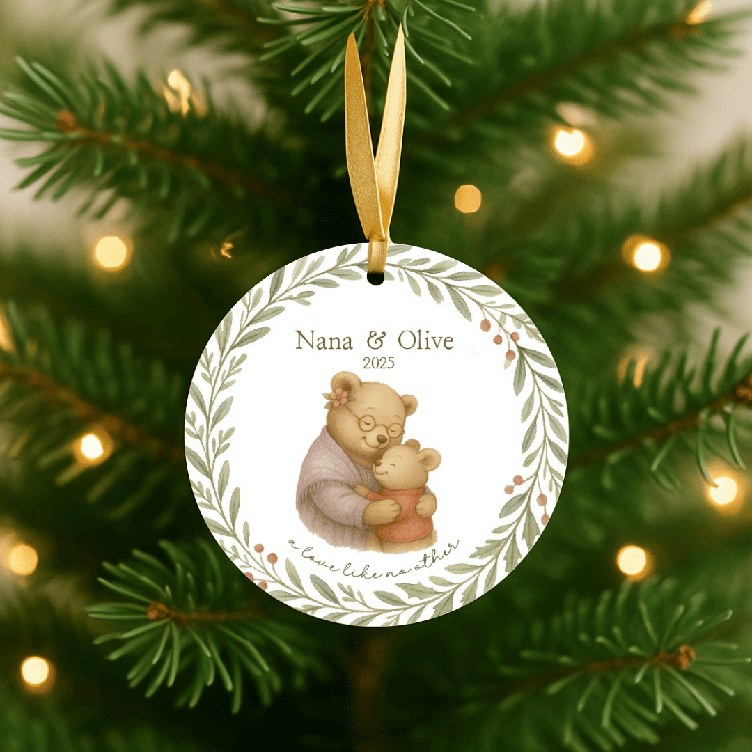 Personalized ceramic Christmas ornament with hugging bunnies, for grandmas and a grandchild, hanging on a Christmas tree