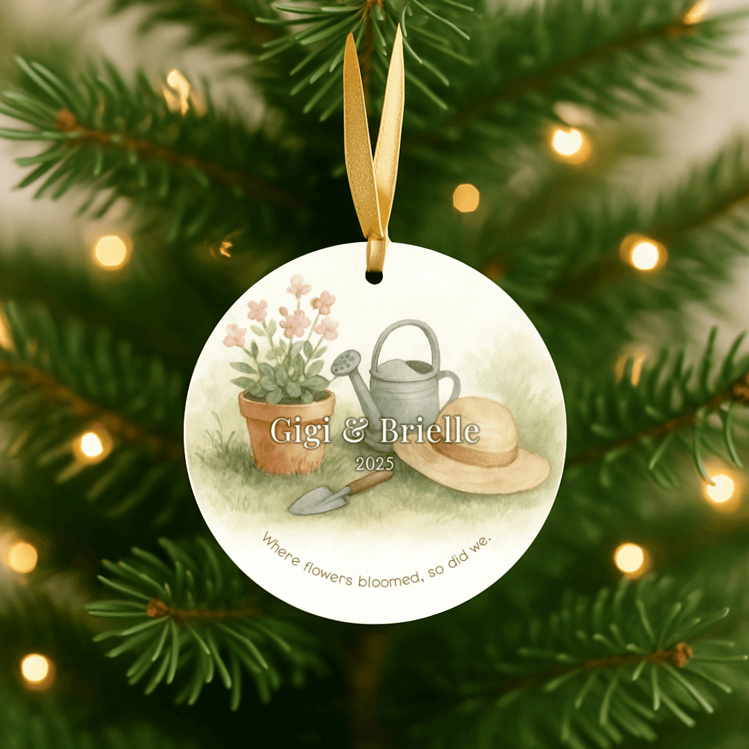 Personalized ceramic Christmas ornament with a gardening themed design for grandma and a grandchild, hanging on a Christmas tree