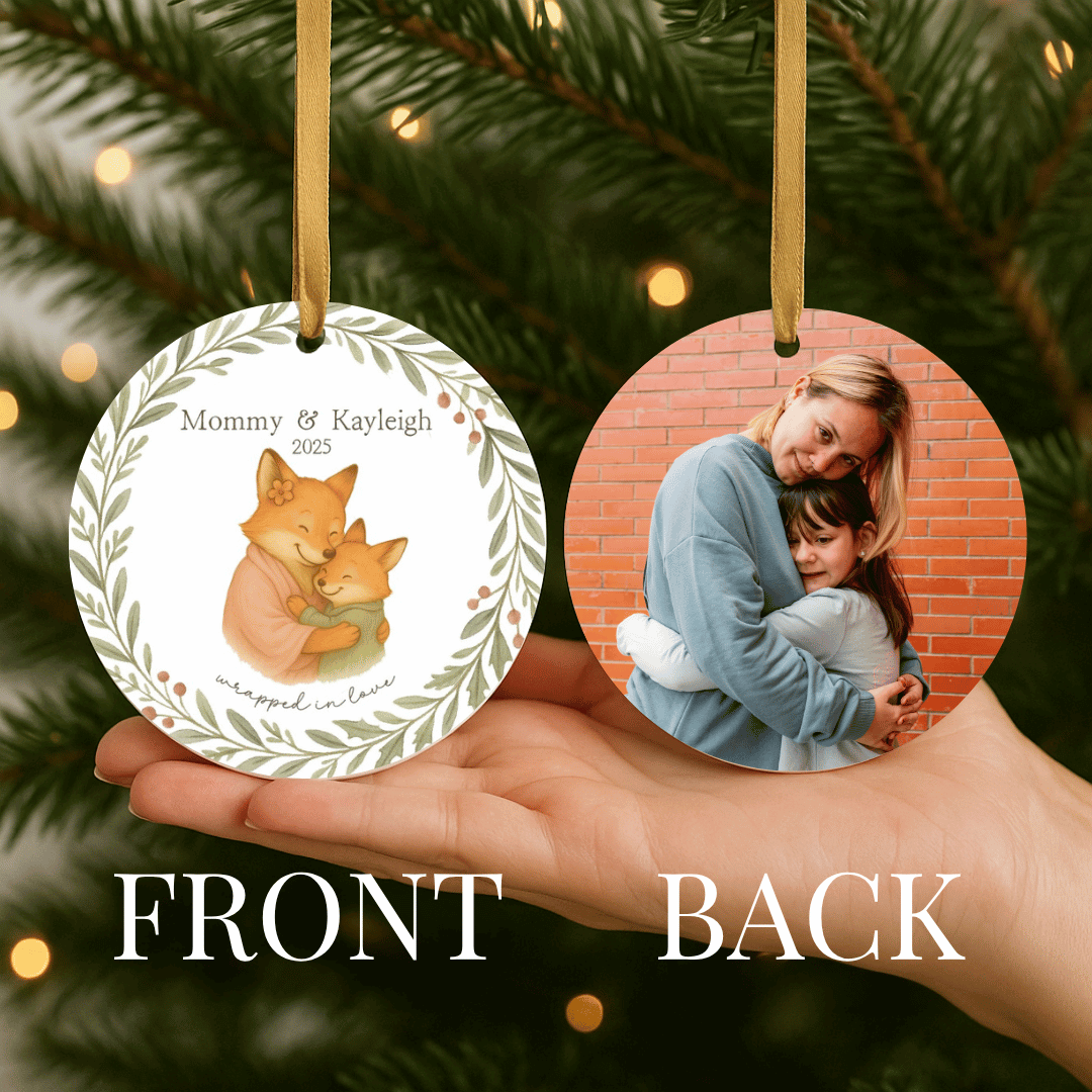 Personalized ceramic Christmas ornament with hugging foxes on the front and a photo on the back, for moms and a child