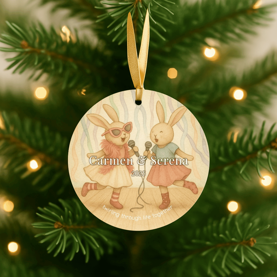 Personalized ceramic Christmas ornament with dancing bunnies, for sisters or young girls, hanging in a tree