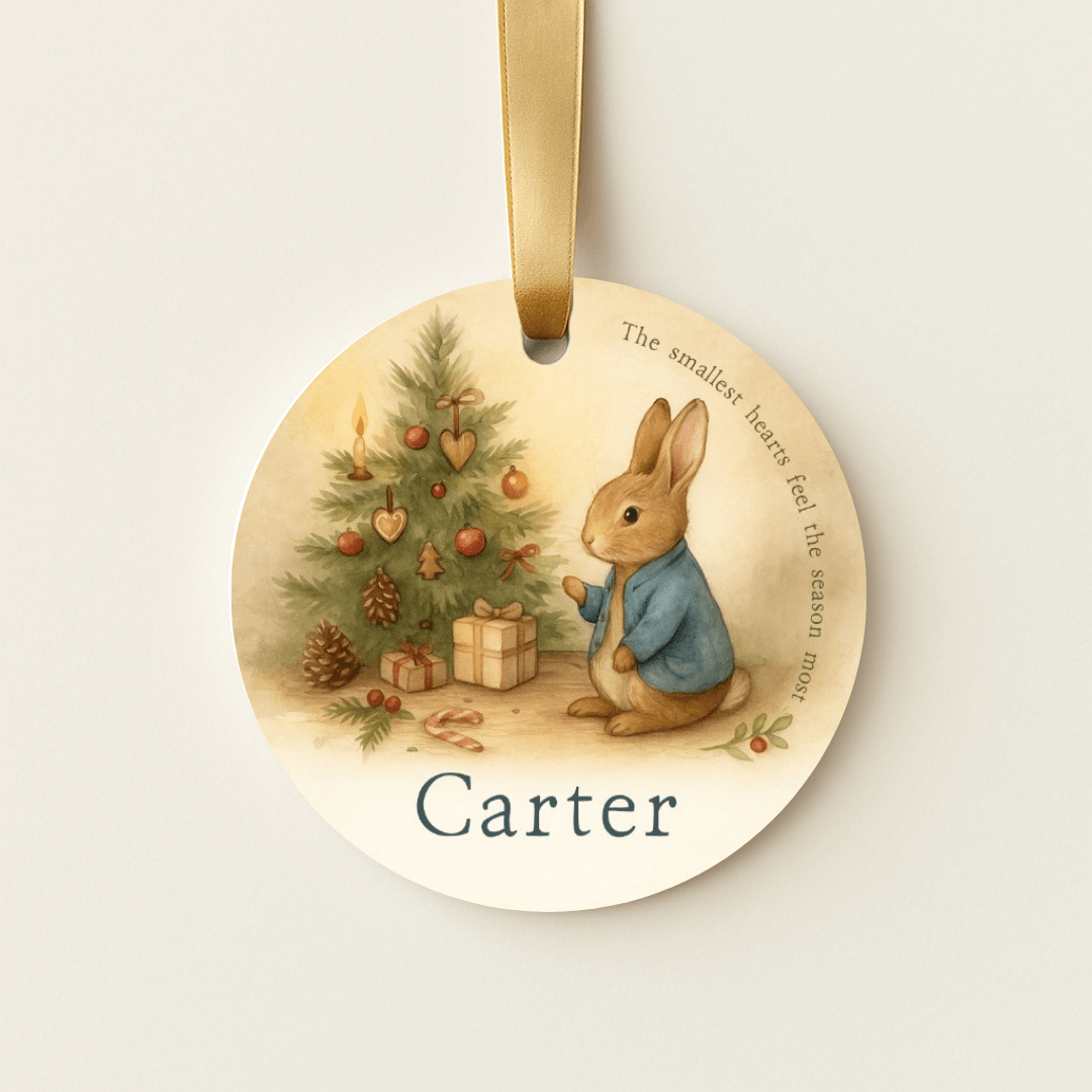 Storybook ornament with a bunny and a small Christmas tree