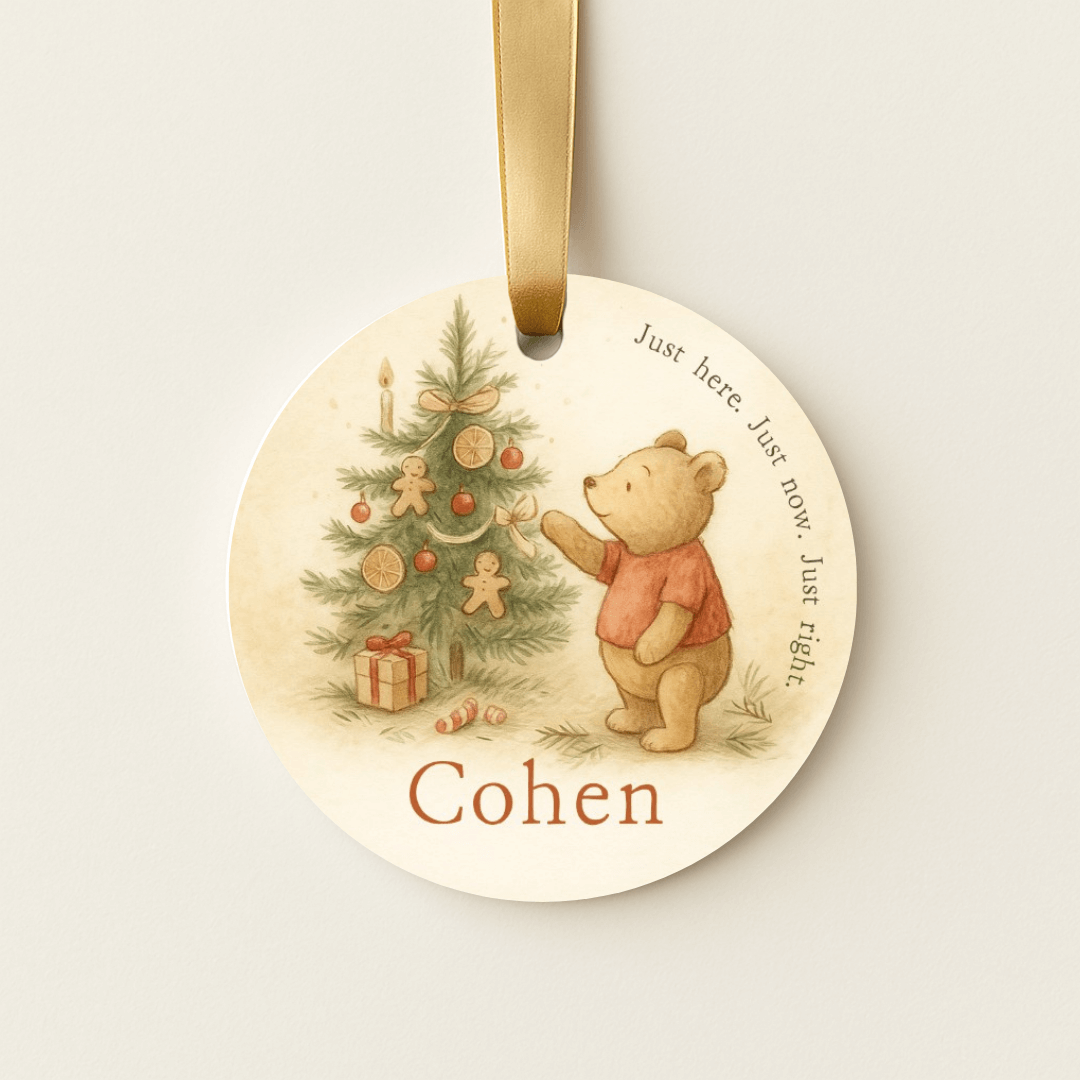 Storybook ornament with a teddy bear and Christmas tree