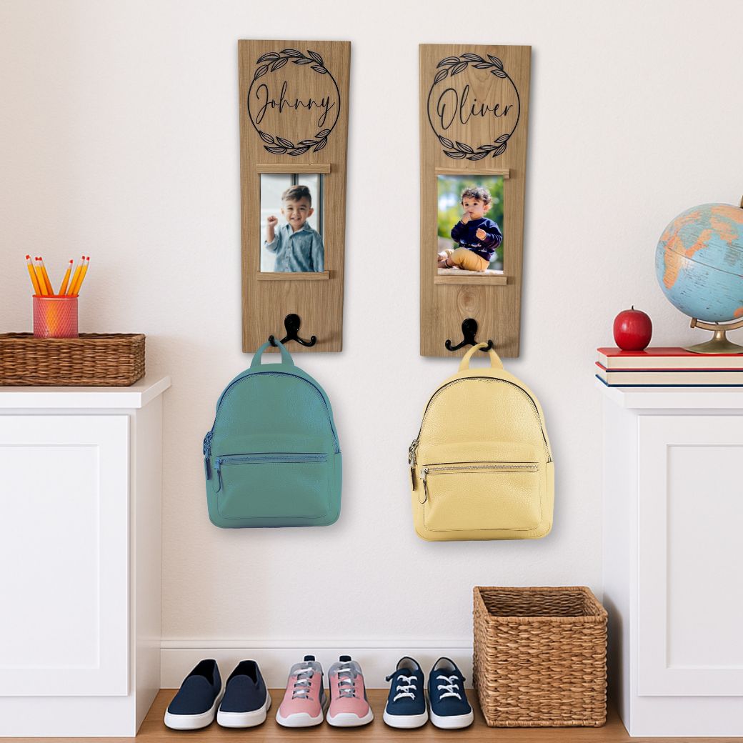 Two wooden wall hooks with photos of children, each holding a backpack, in a room setting.