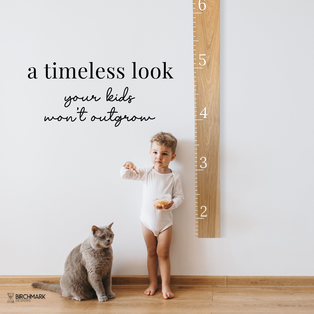 Child standing next to a solid hickory growth chart, featuring white inches and numbers