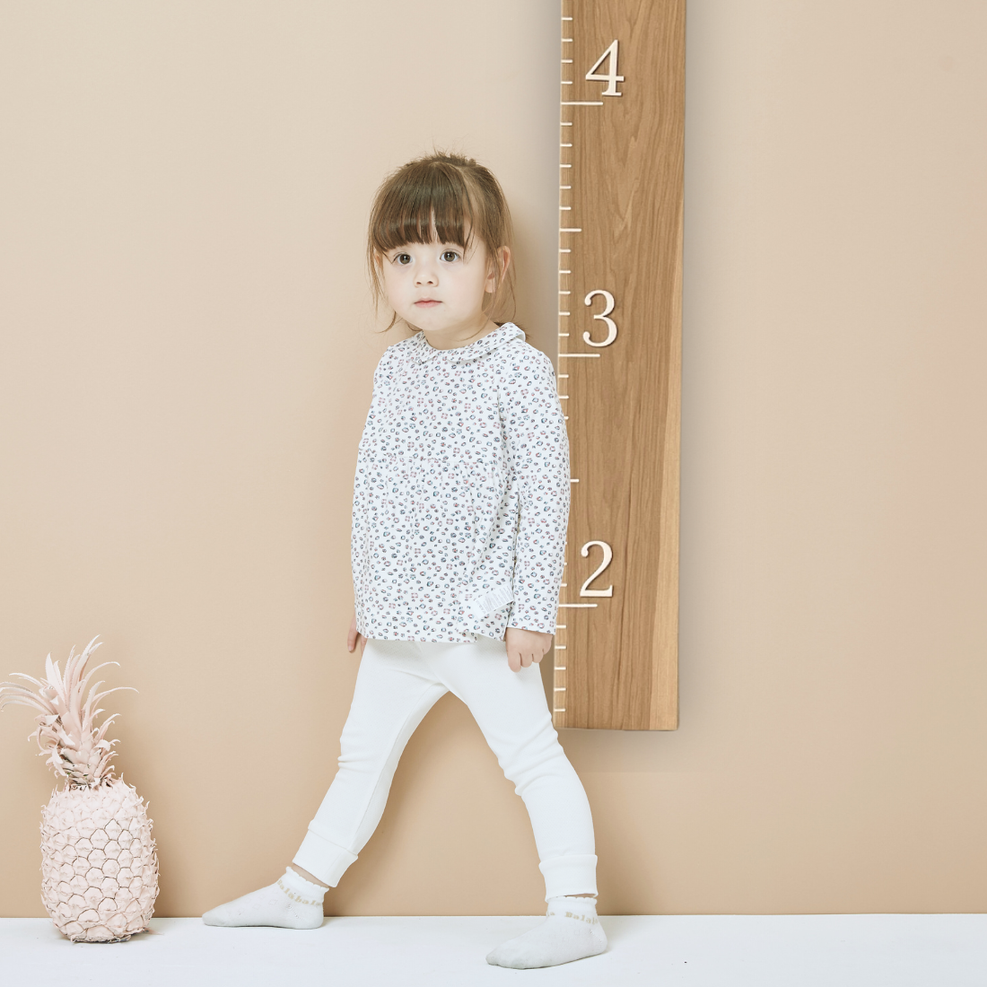 Handcrafted hickory growth ruler with white notches, perfect for tracking kids’ height milestones
