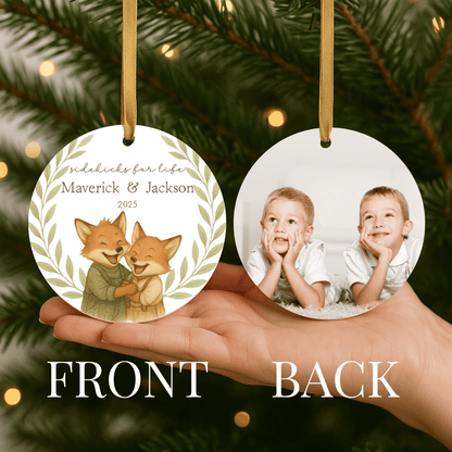 Personalized ceramic Christmas ornament with hugging foxes on one side and a photo on the back, for brothers or young boys