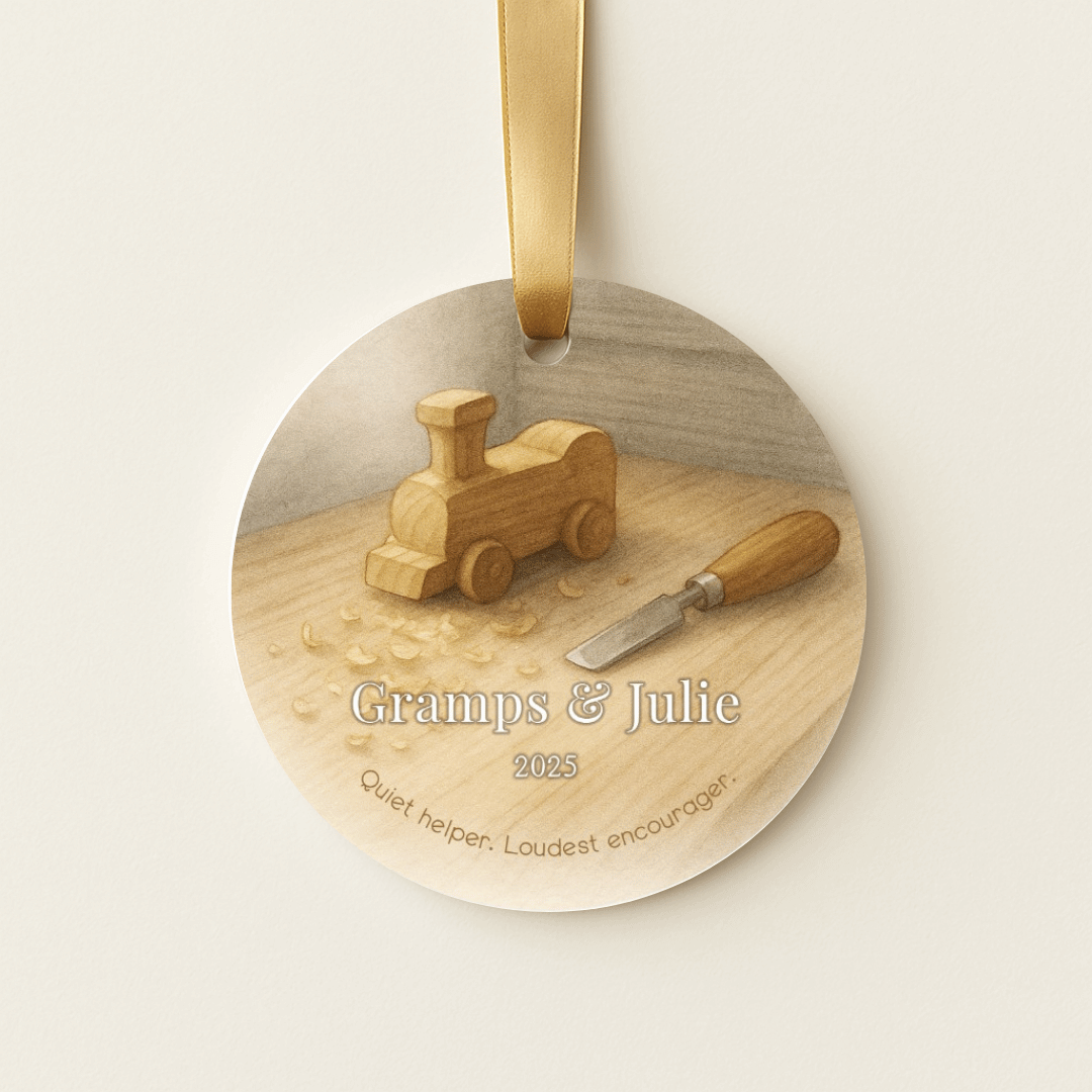Personalized ceramic Christmas ornament with a toy wooden train and chisel for grandpa and a grandchild