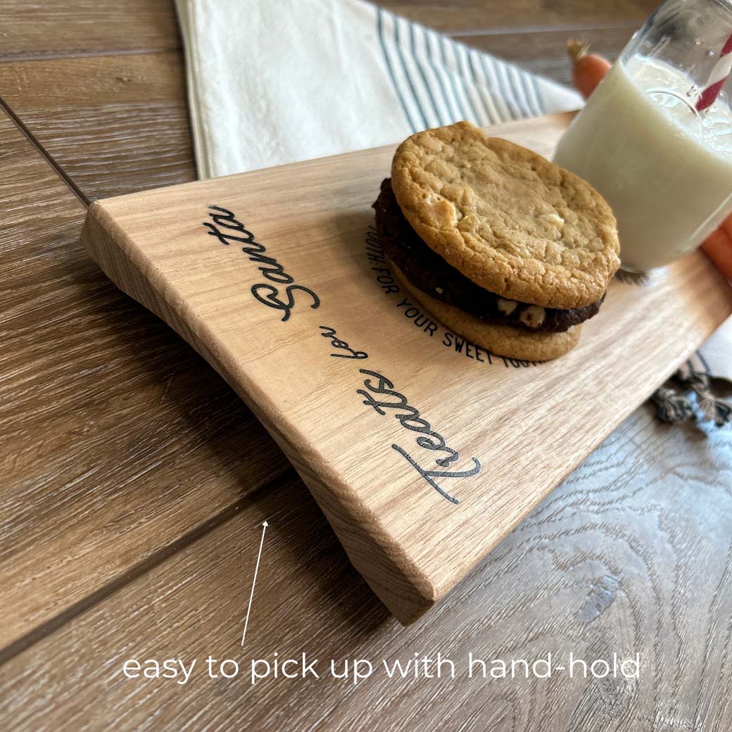 Personalized santa cookie tray closeup of hand-hold