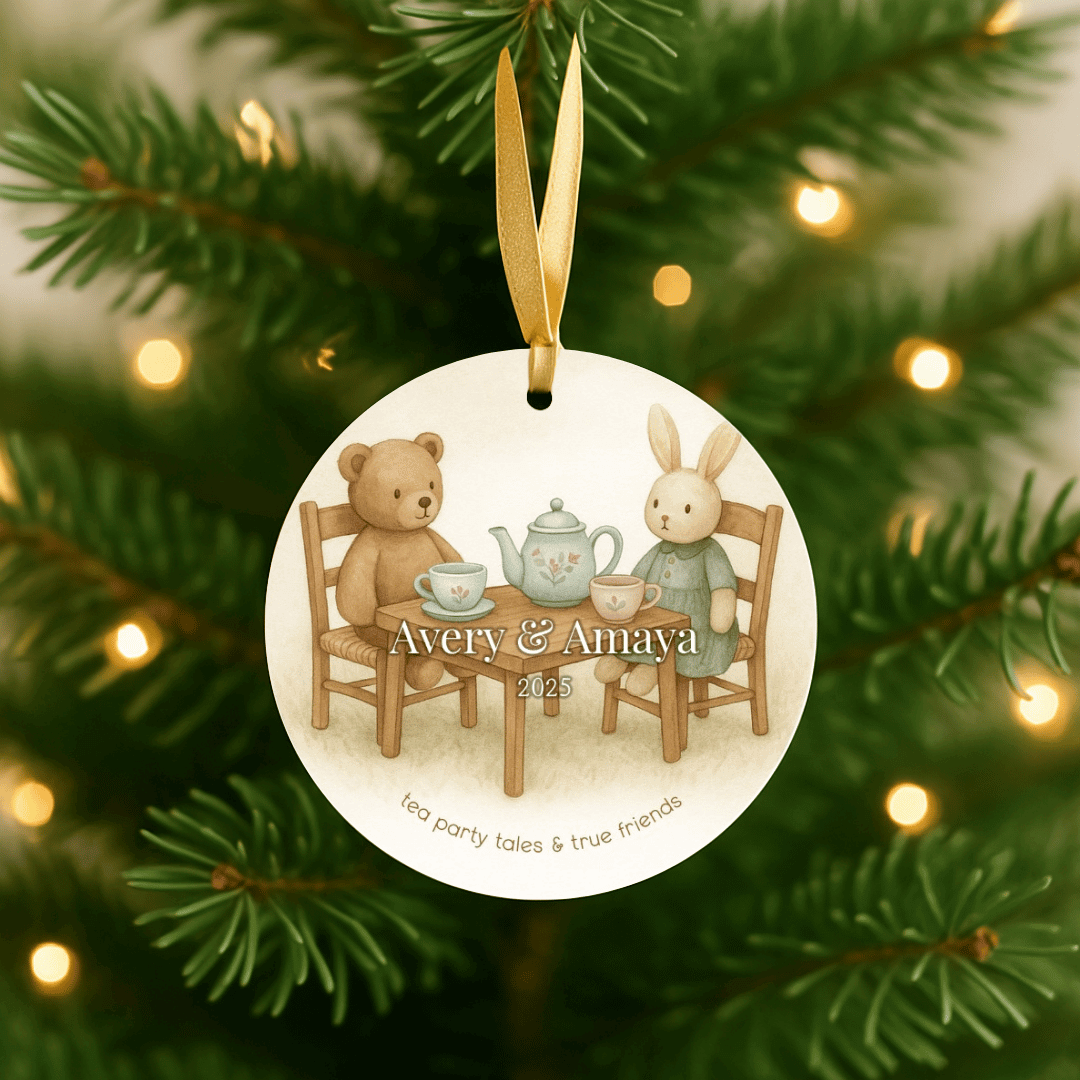 Personalized ceramic Christmas ornament with a tea party design, for sisters or young girls, hanging on a Christmas tree