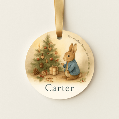 Storybook ornament with a bunny and a small Christmas tree