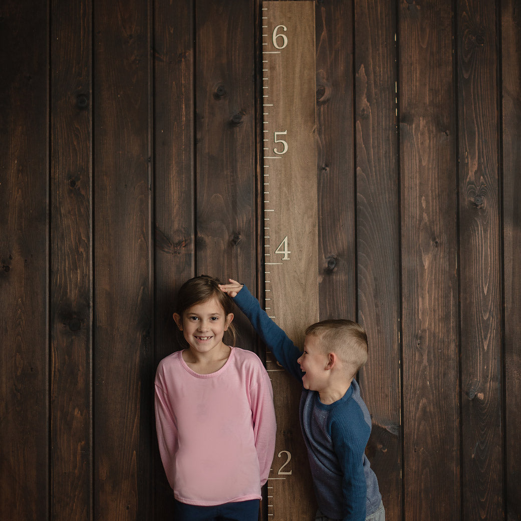 stained walnut growth ruler with kids