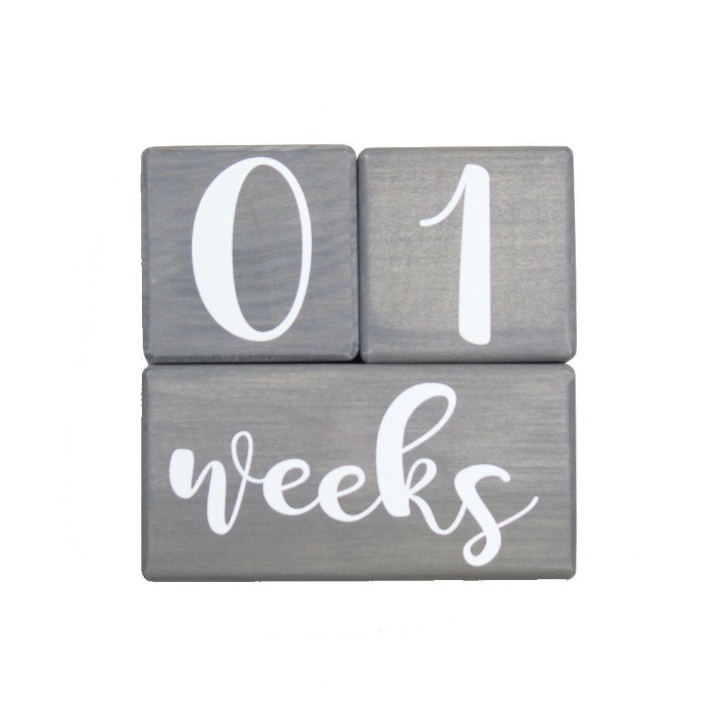 Birch baby milestone blocks in gray stain showing 01 weeks