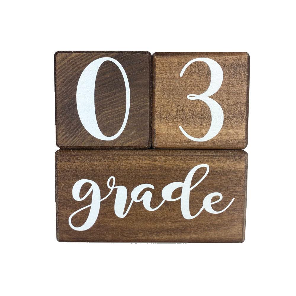 Birch baby milestone blocks in walnut showing 03 grade