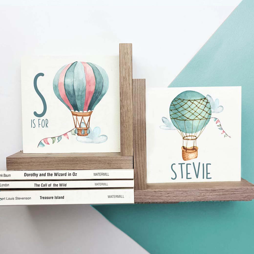 L shaped hot air ballon nursery bookends in teal and pink