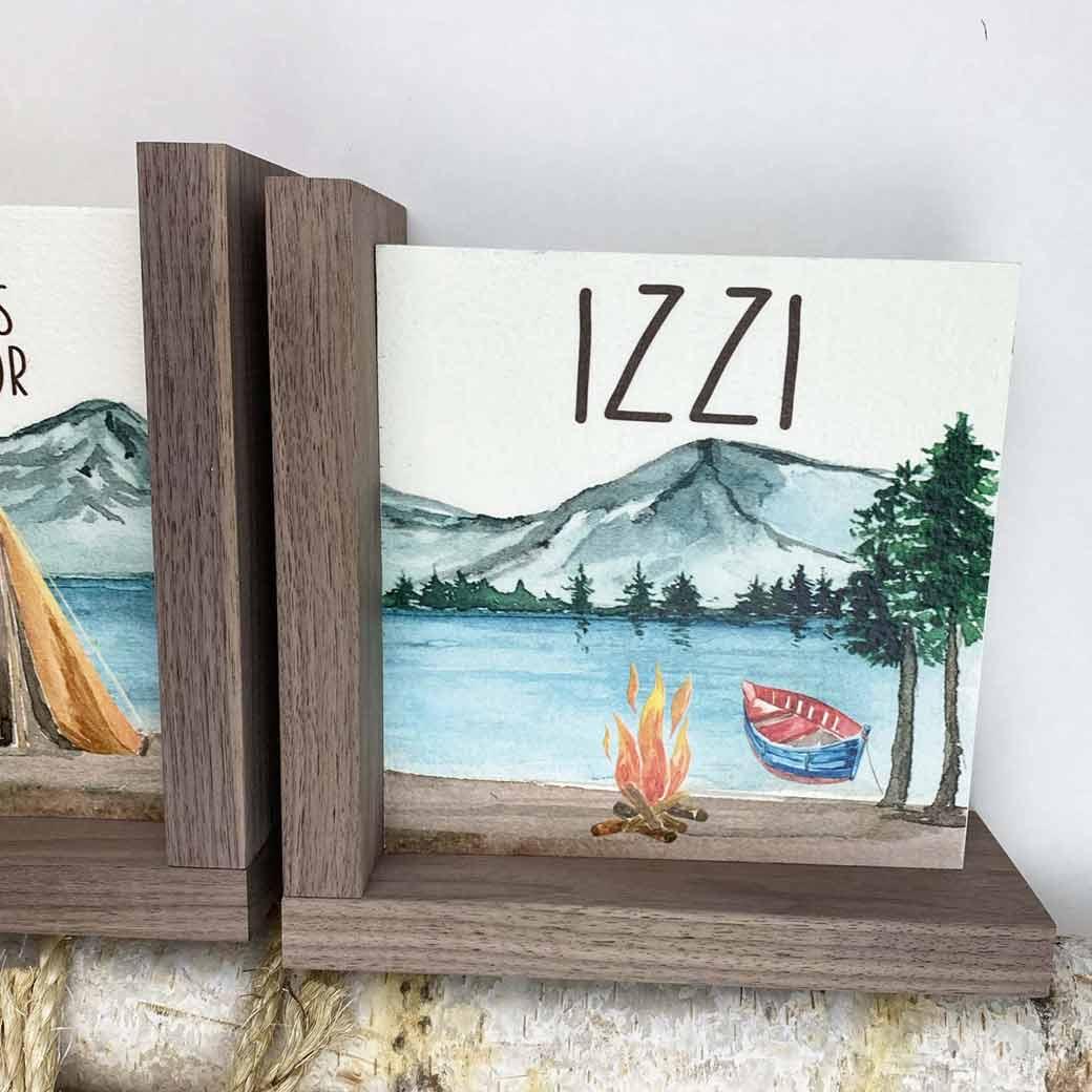 Mountain nursery bookend set with lake and campfire personalized for Izzi