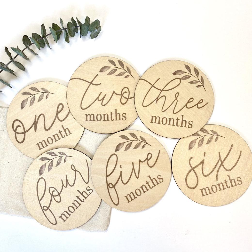 Olive baby milestone cards showing 1 to 6 months