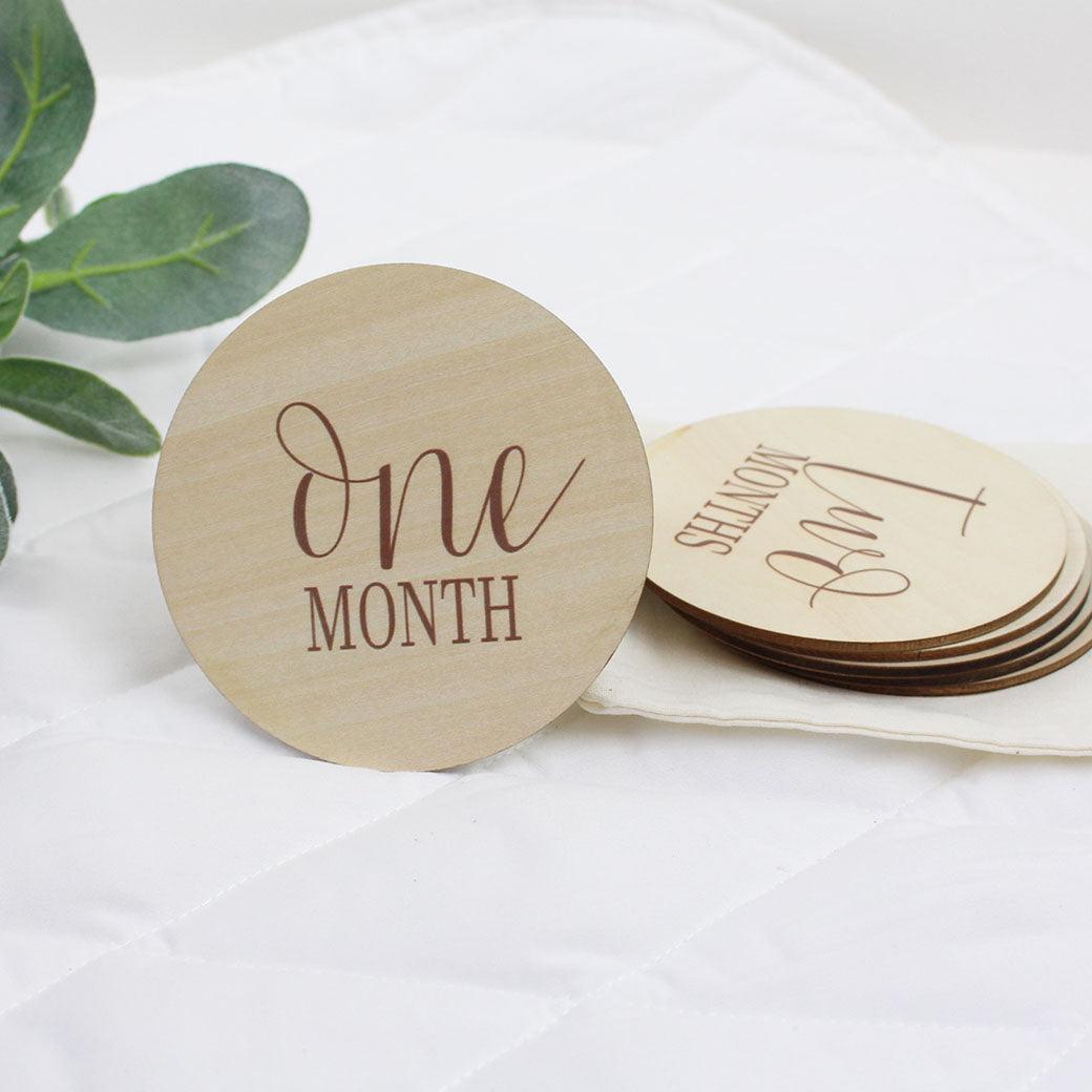 Simple baby monthly milestone cards showing 1 month in camel