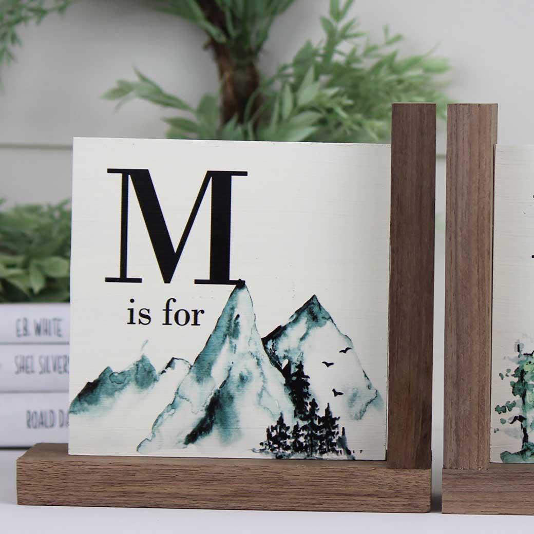 L-shaped snowy mountain nursery bookends letter M