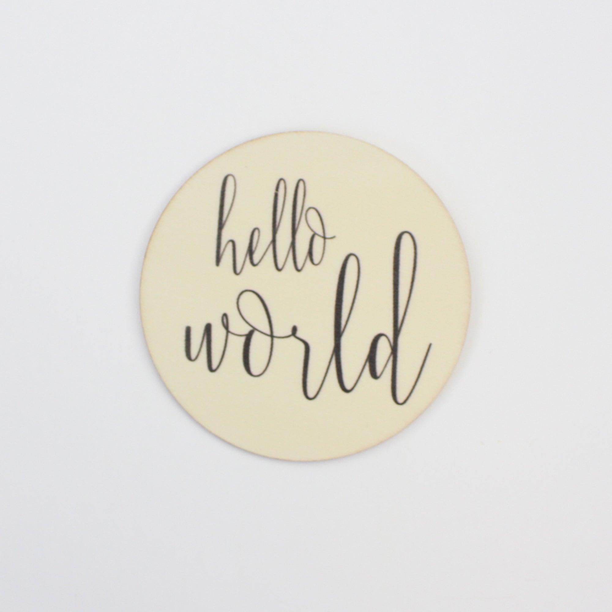 Birth announcement disc that says "Hello World"
